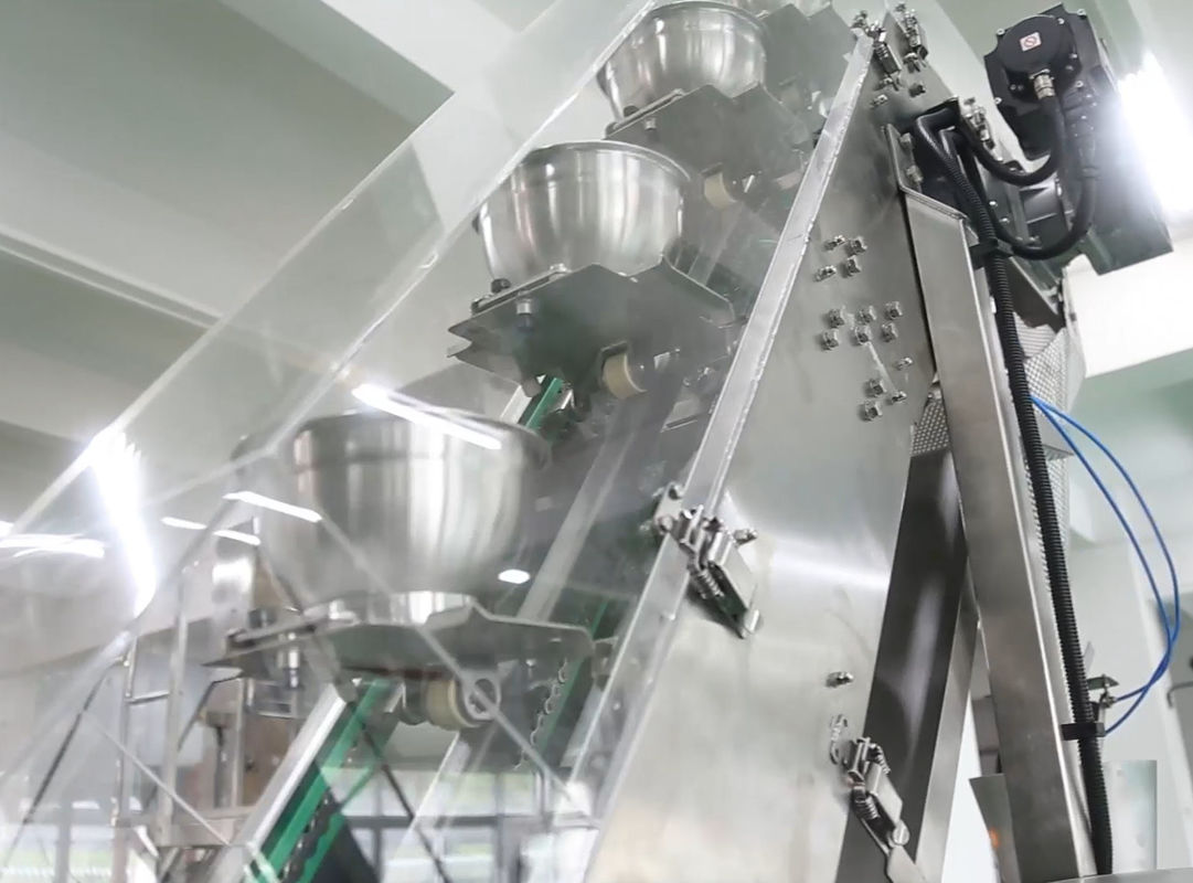 14 دستگاه بسته بندی دستگاه Mutihead Weigher VFFS کاسه آسانسور برای میوه های منجمد لوبیا شکلاتی